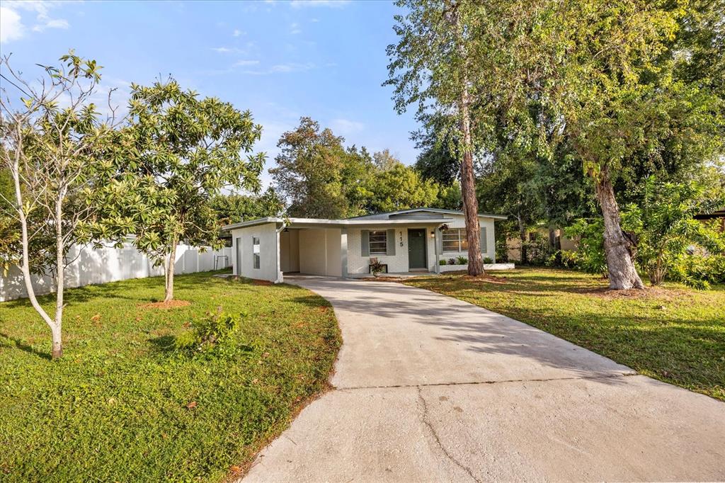 115 West Fillmore Avenue Orlando, FL 32809 - Photo 23 of 23 front view of a house with a yard