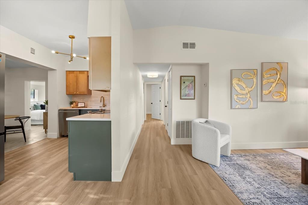 115 West Fillmore Avenue Orlando, FL 32809 - Photo 4 of 23 a living room with furniture and a wooden floor