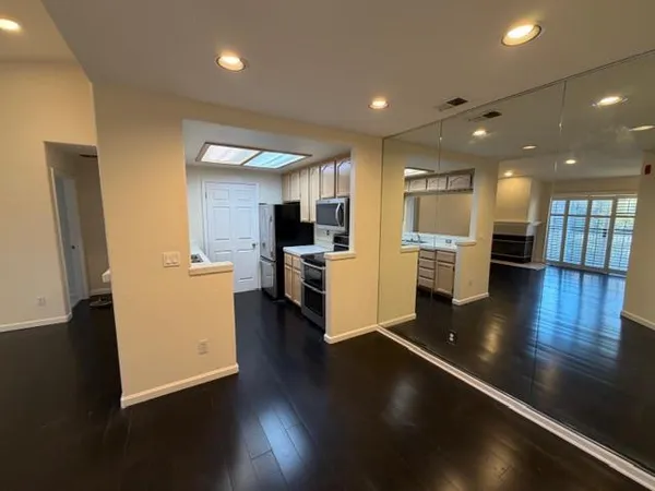 a room with wooden floor and utility