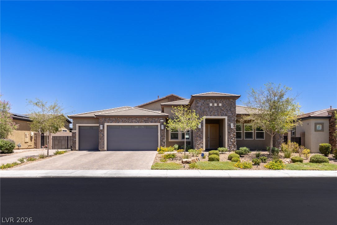 7036 Arabian Ridge Street Las Vegas, NV 89131 - Photo 2 of 64 Single Story Stunner with Elegant stone accents, 3 Car Garage, and RV Parking