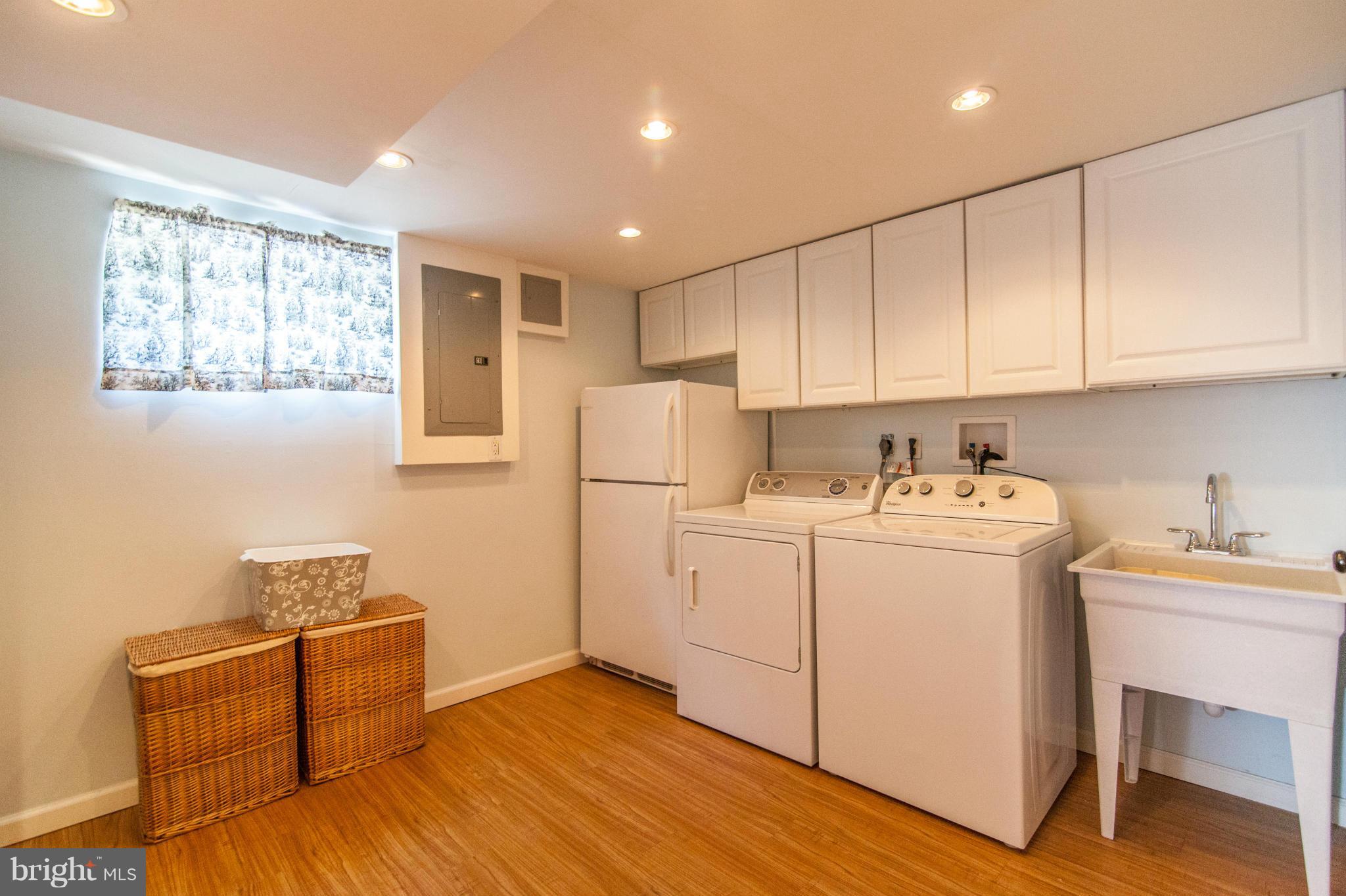 8514 Grubb Road Chevy Chase, MD 20815 - Photo 27 of 30 Bright laundry room with laundry tub