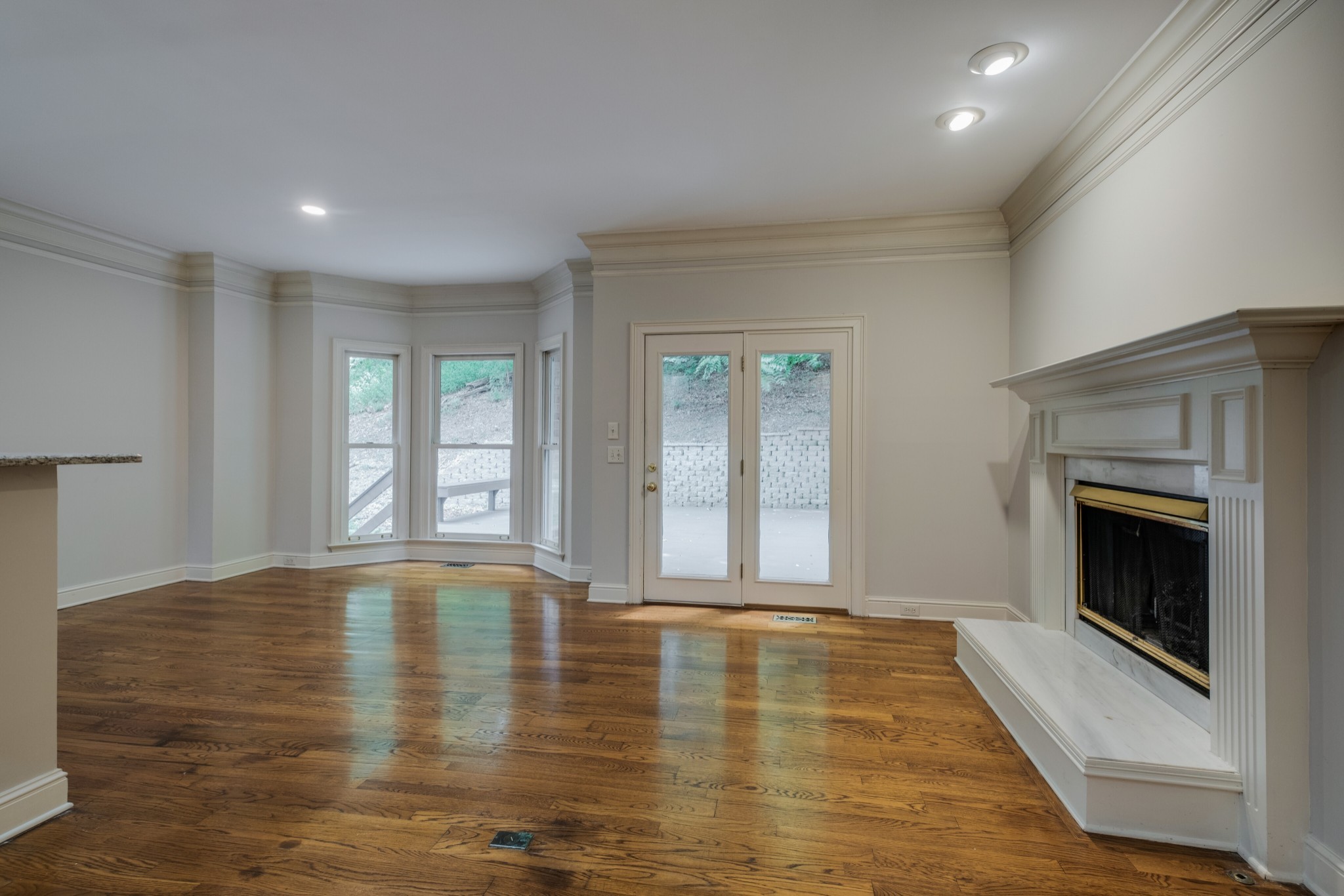 3026 Smith Lane Franklin, TN 37069 - Photo 13 of 39 a view of an empty room with a fireplace and a window