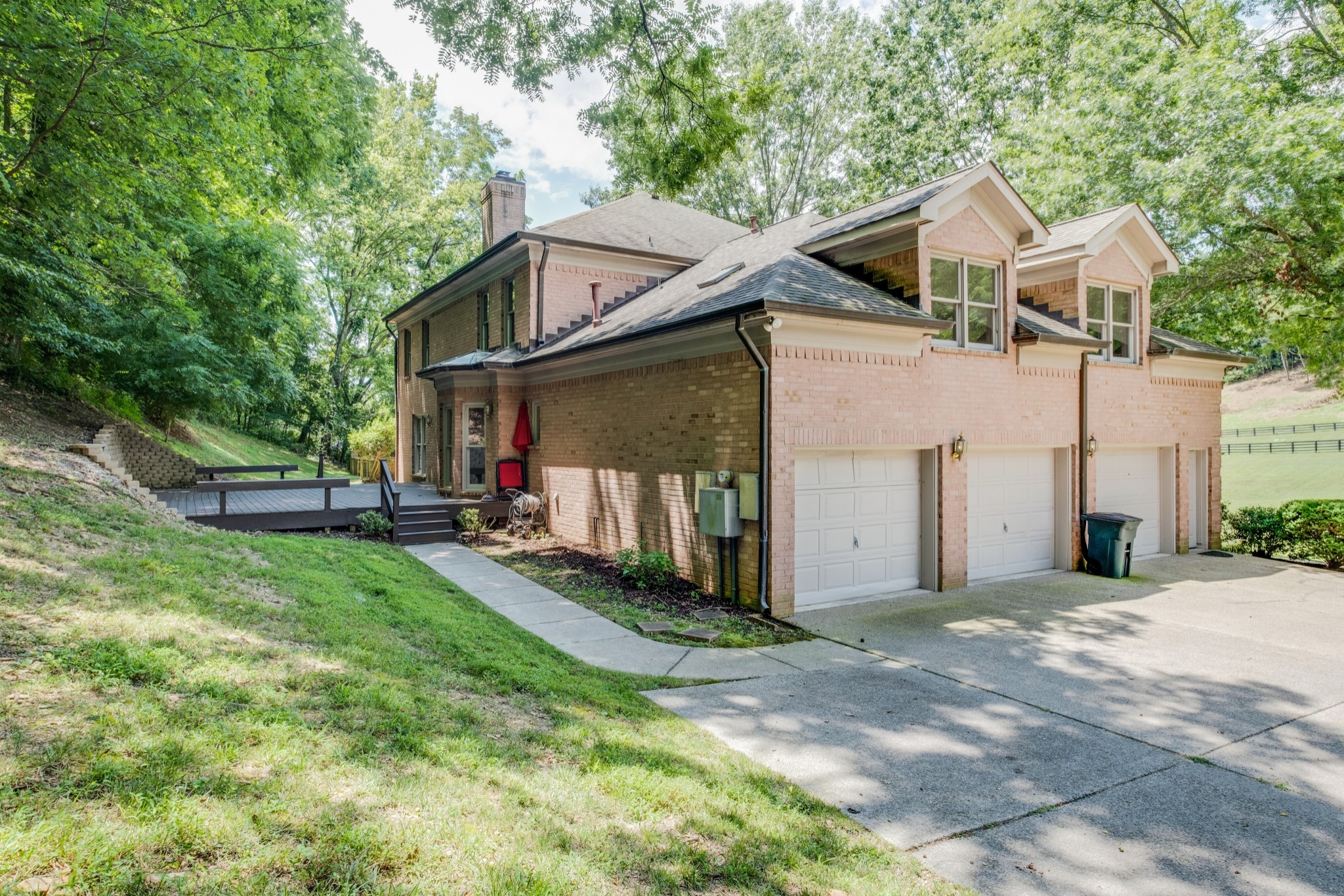 3026 Smith Lane Franklin, TN 37069 - Photo 34 of 39 a front view of a house with a yard and garage