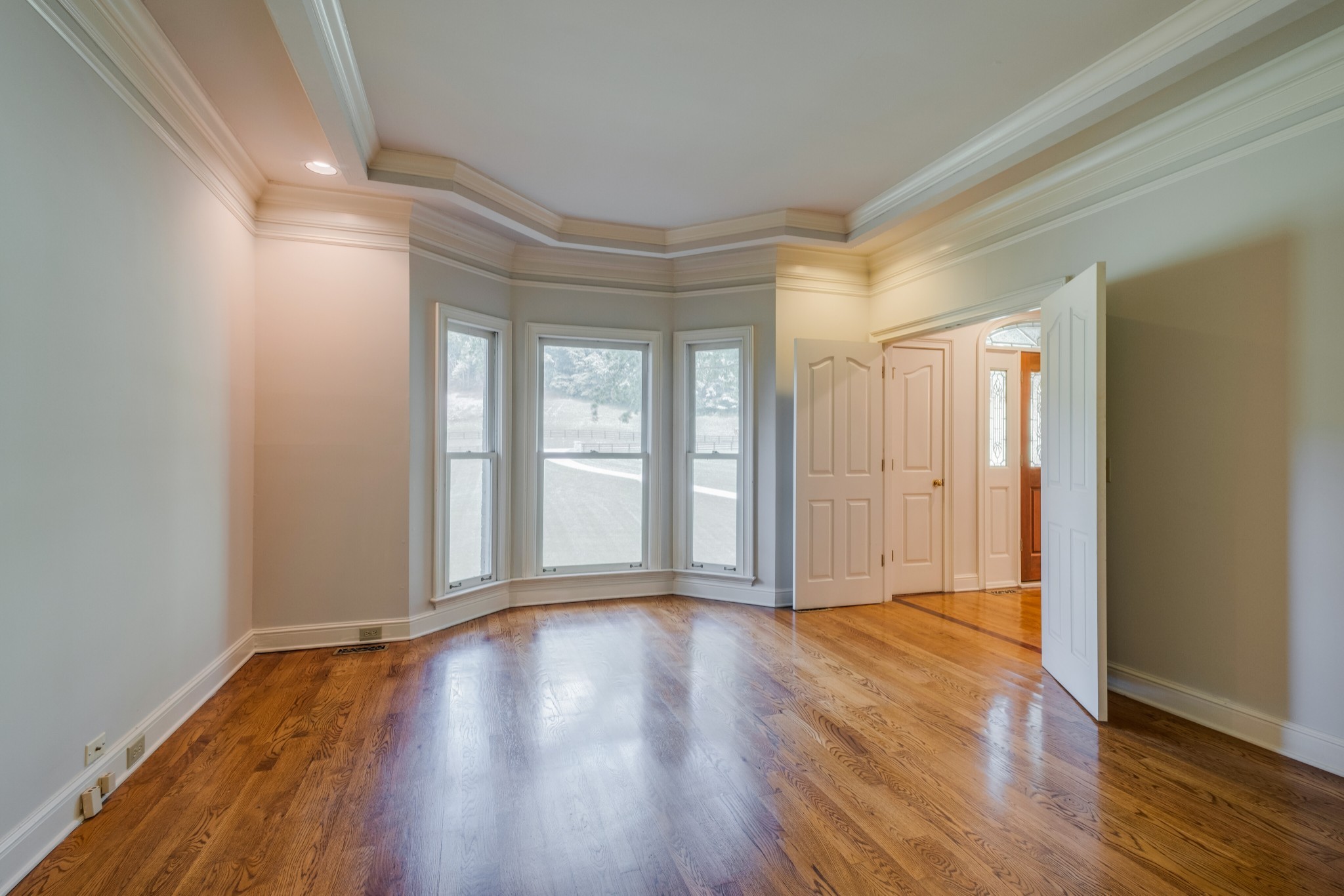 3026 Smith Lane Franklin, TN 37069 - Photo 8 of 39 a view of an empty room with wooden floor and a window
