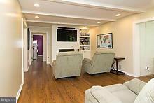 12908 Gent Road Reisterstown, MD 21136 - Photo 13 of 29 a living room with a couch and a flat screen tv