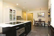12908 Gent Road Reisterstown, MD 21136 - Photo 3 of 29 a kitchen with center island table and chairs