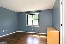 12908 Gent Road Reisterstown, MD 21136 - Photo 21 of 29 a room with a window and wooden floor