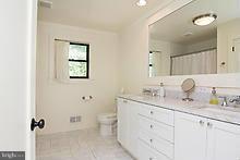 12908 Gent Road Reisterstown, MD 21136 - Photo 23 of 29 a bathroom with a granite countertop sink mirror and double