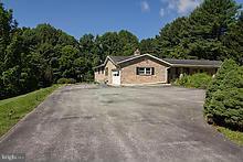 12908 Gent Road Reisterstown, MD 21136 - Photo 27 of 29 a house with trees in the background