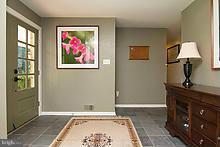 12908 Gent Road Reisterstown, MD 21136 - Photo 5 of 29 a view of a bedroom with wooden floor and cabinet