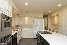 12908 Gent Road Reisterstown, MD 21136 - Photo 10 of 29 a kitchen with a sink stove and cabinets