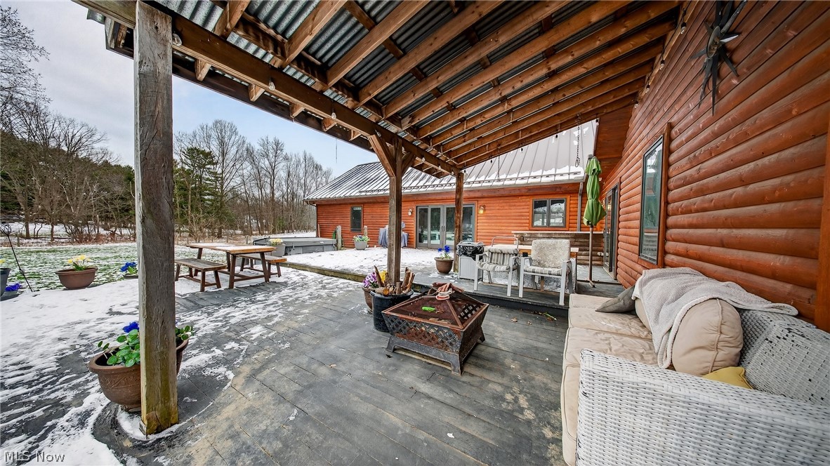 1693 Middleton Road Hudson, OH 44236 - Photo 40 of 48 Snow covered patio with a jacuzzi and a deck
