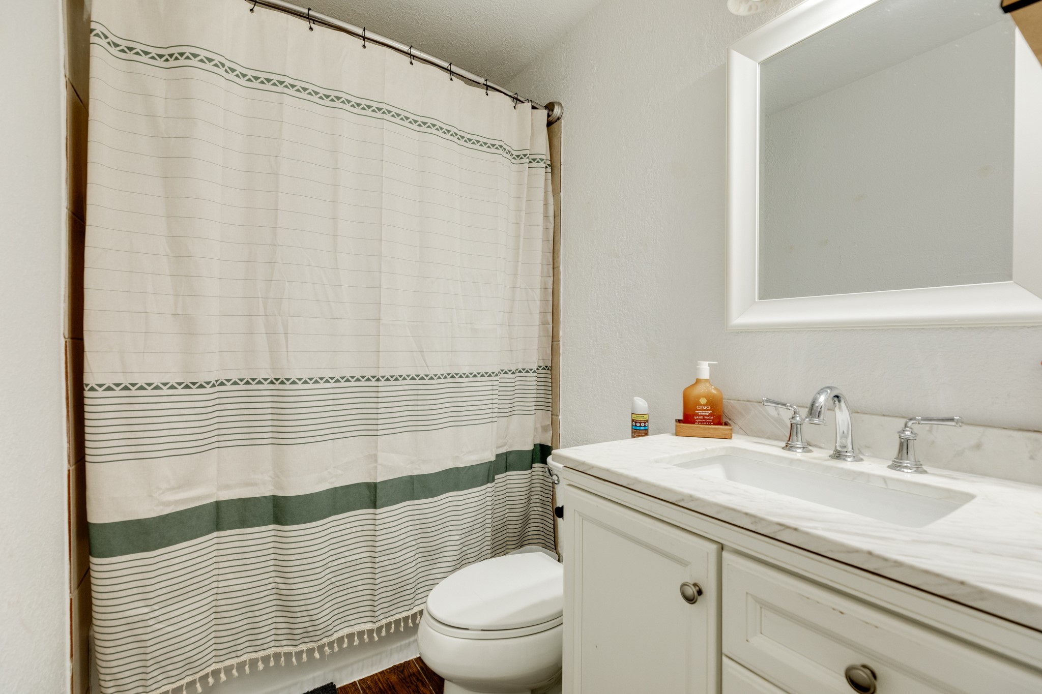 511 Bryan Street Angleton, TX 77515 - Photo 14 of 14 a bathroom with a sink toilet and shower