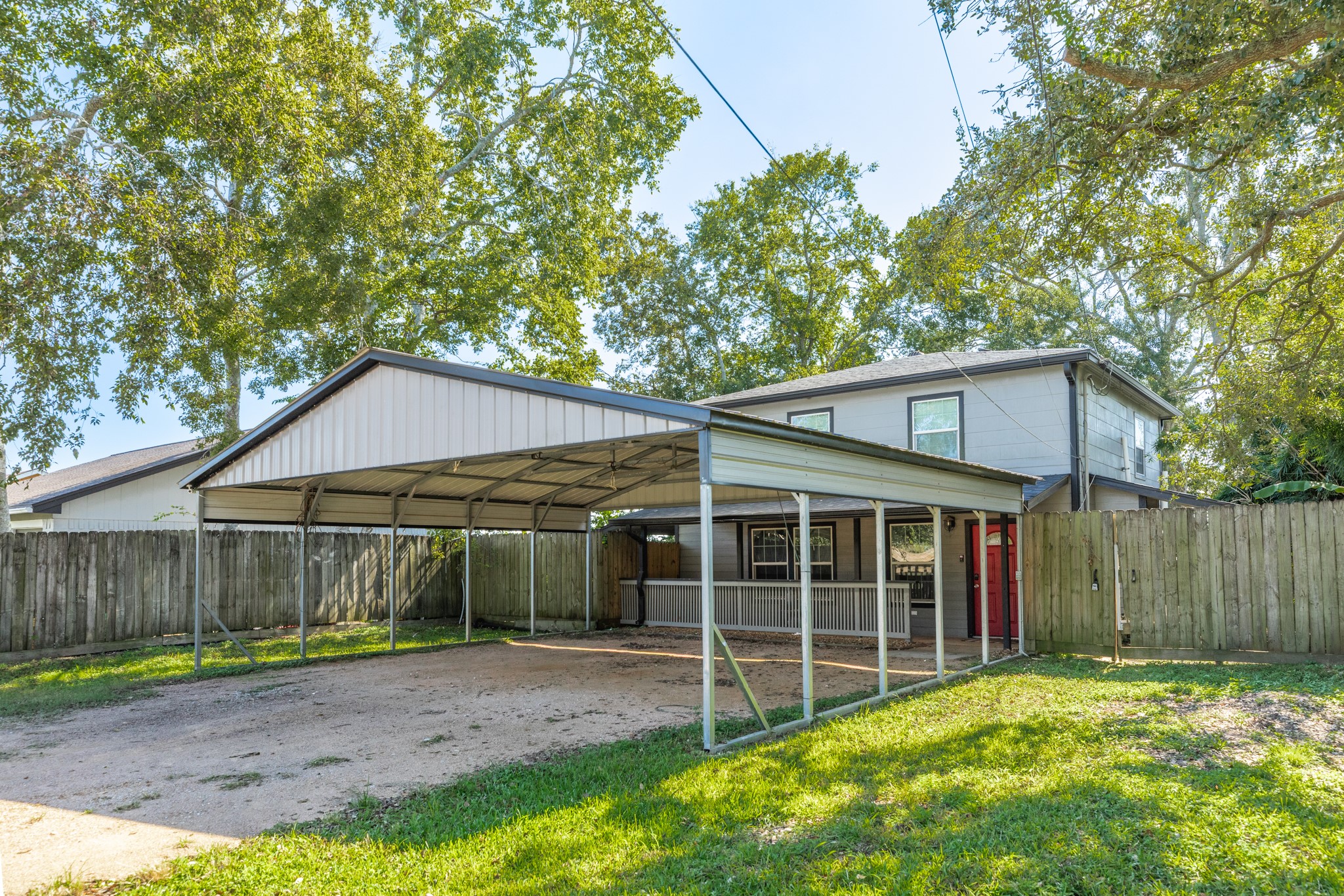 511 Bryan Street Angleton, TX 77515 - Photo 2 of 14 a view of a house with a yard and wooden fence