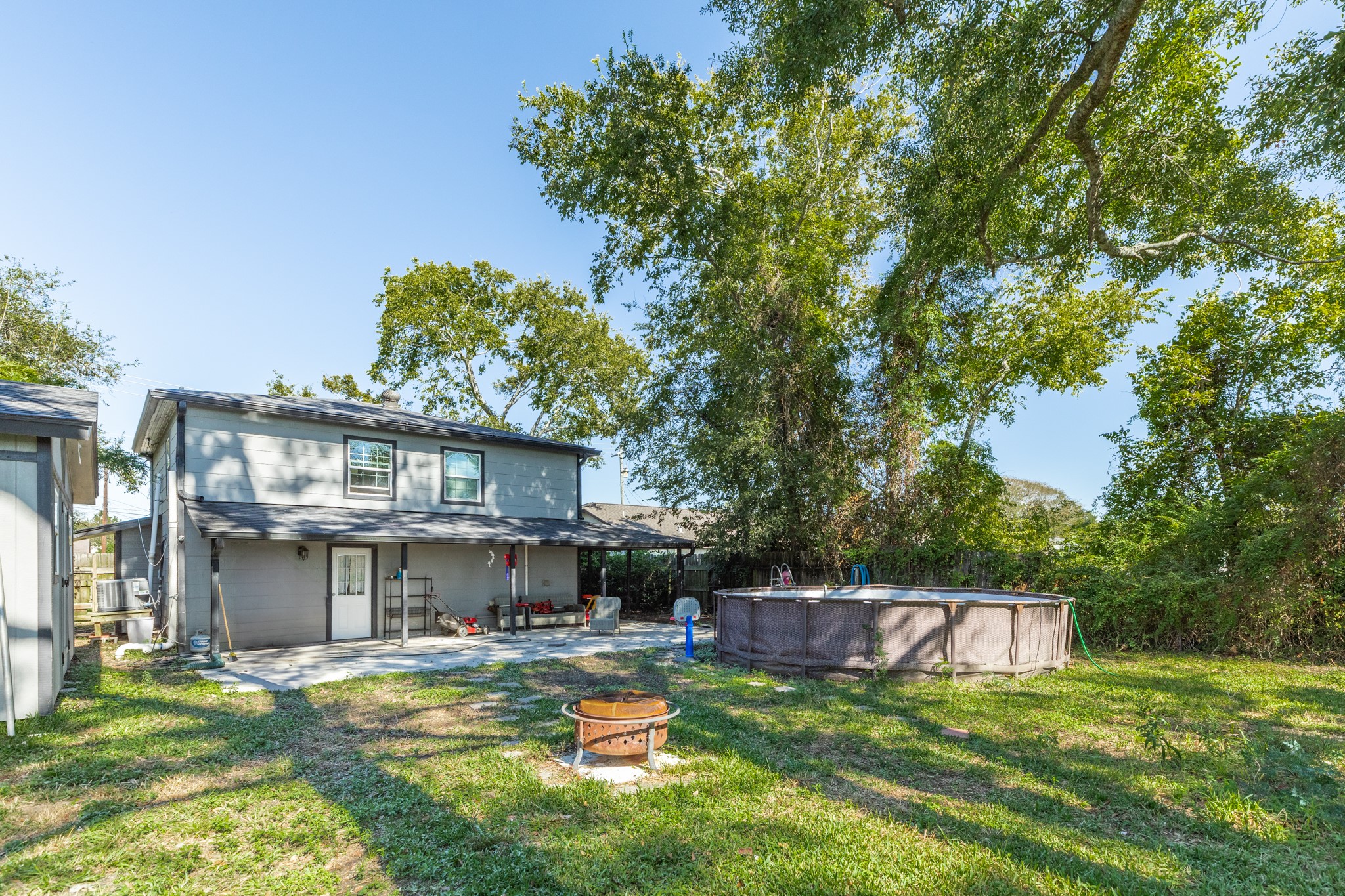 511 Bryan Street Angleton, TX 77515 - Photo 3 of 14 a view of a house with swimming pool and sitting area