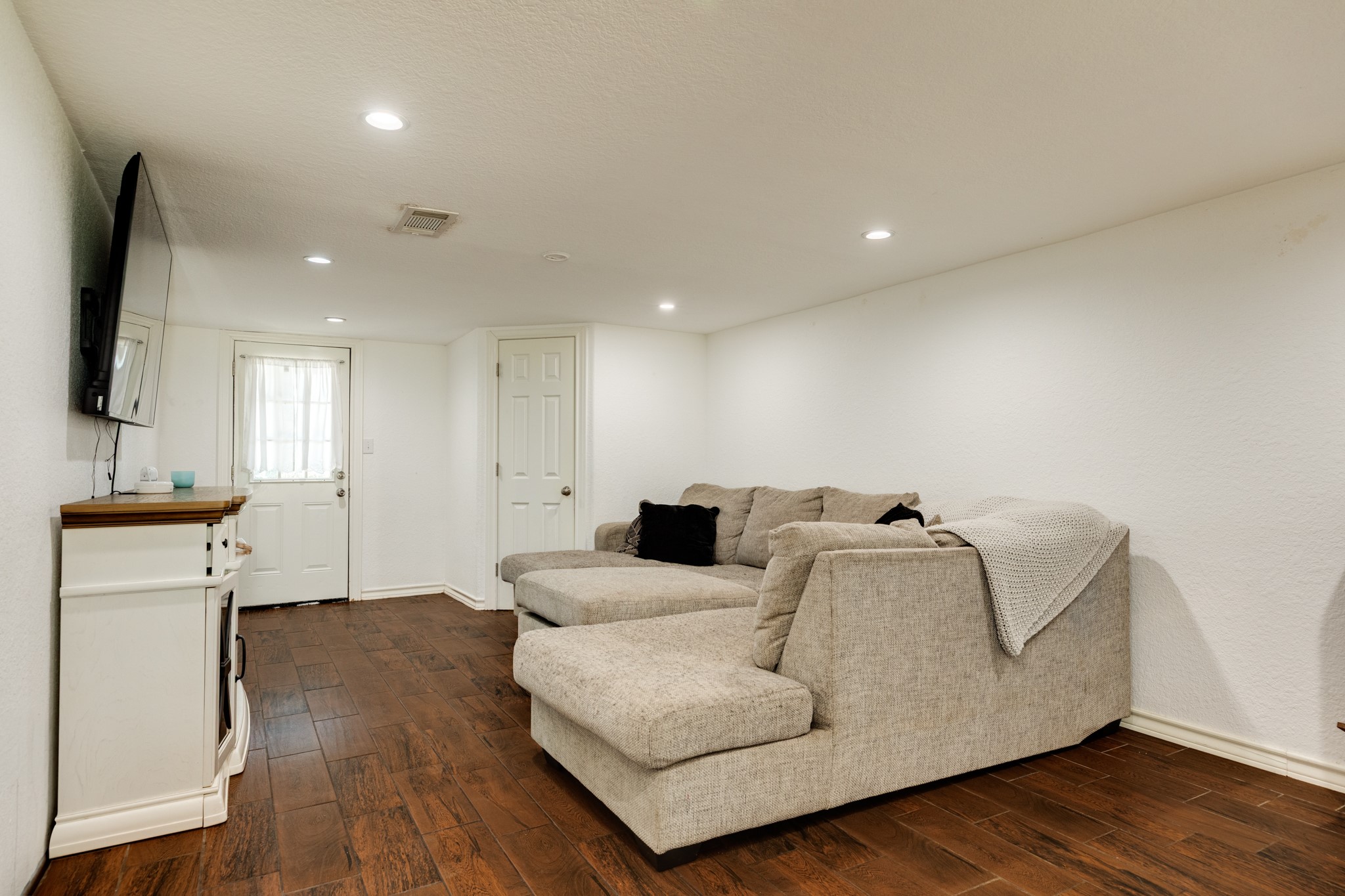 511 Bryan Street Angleton, TX 77515 - Photo 4 of 14 a living room with furniture and a flat screen tv