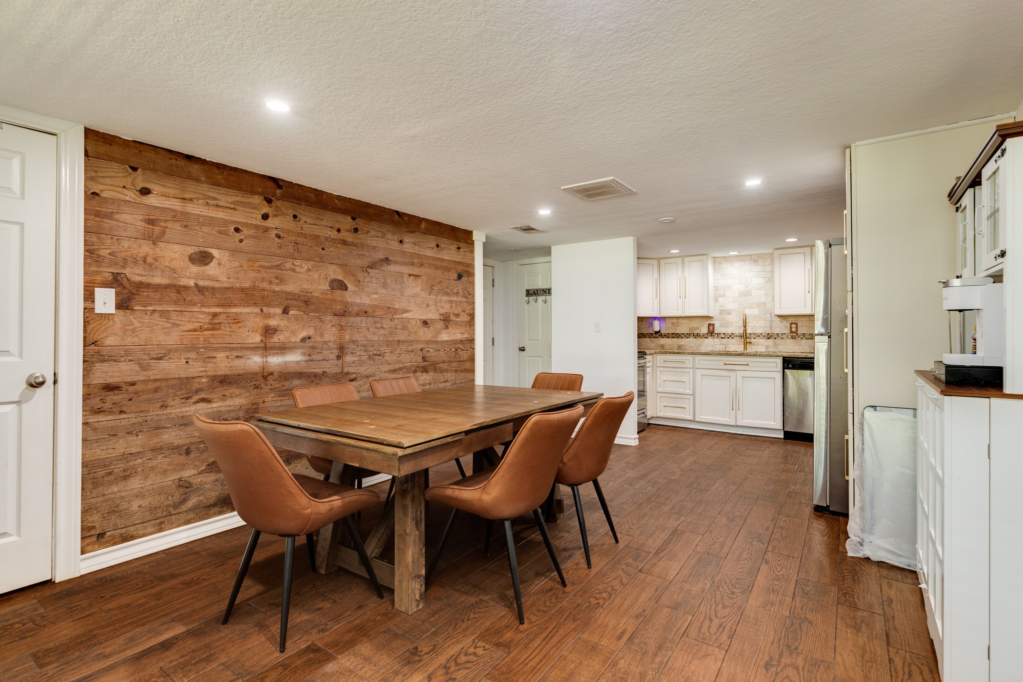 511 Bryan Street Angleton, TX 77515 - Photo 7 of 14 a view of a dining room with furniture and wooden floor