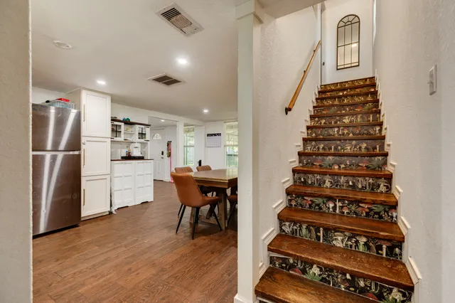 a view of kitchen with furniture and wooden floor