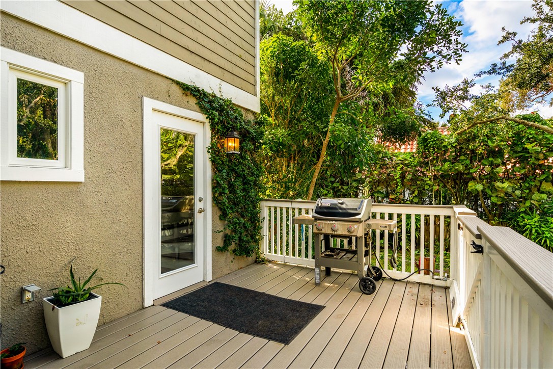 975 Riomar Drive Vero Beach, FL 32963 - Photo 16 of 34 a balcony with wooden floor table and chairs