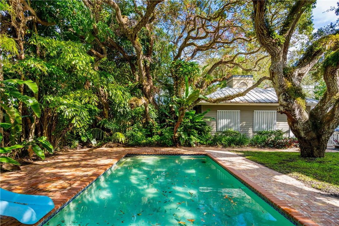 975 Riomar Drive Vero Beach, FL 32963 - Photo 18 of 34 a view of a backyard with a garden