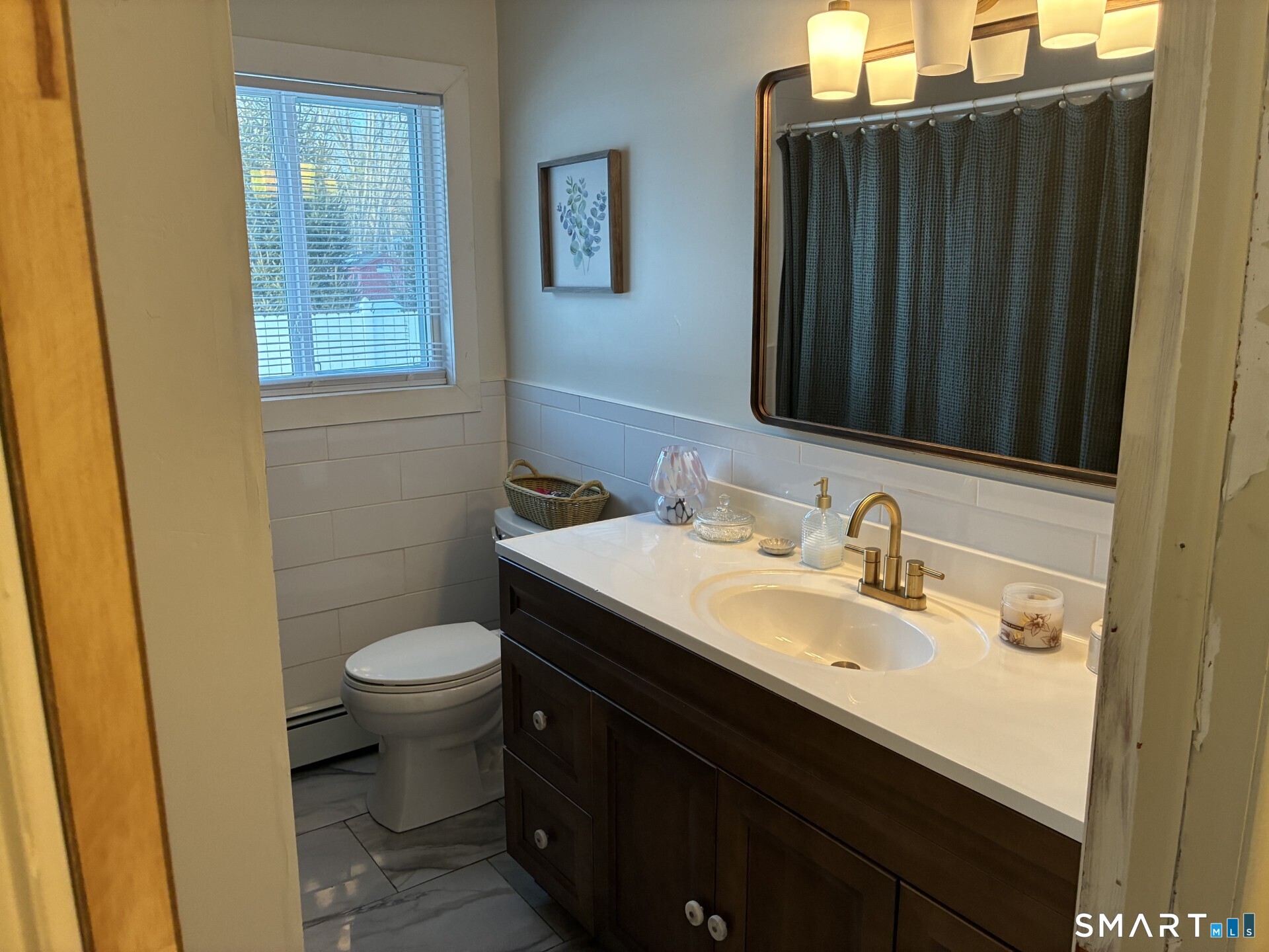 4 Shady Rest Boulevard Newtown, CT 06482 - Photo 12 of 34 a bathroom with a sink and a mirror