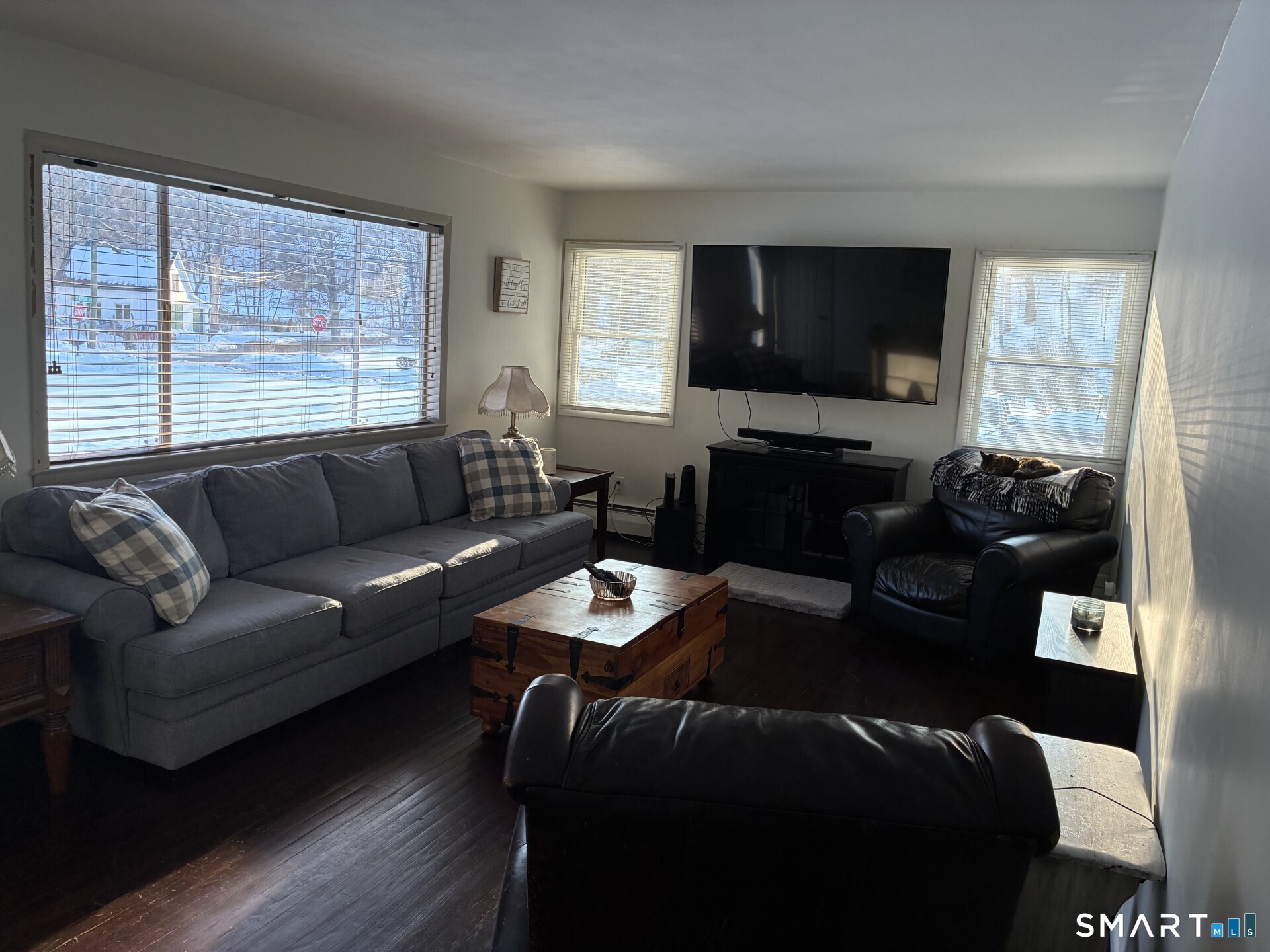 4 Shady Rest Boulevard Newtown, CT 06482 - Photo 9 of 34 a living room with furniture a large window and a flat screen tv