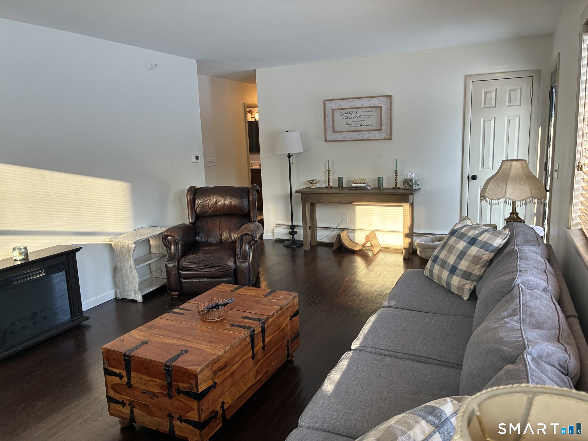 4 Shady Rest Boulevard Newtown, CT 06482 - Photo 10 of 34 a living room with furniture and a flat screen tv