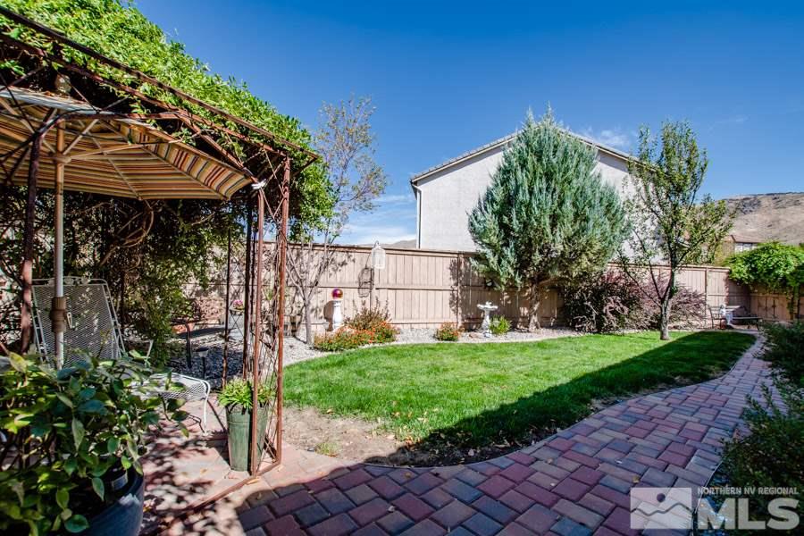10655 Cedar Bend Court Reno, NV 89521 - Photo 12 of 16 a view of a house with a yard