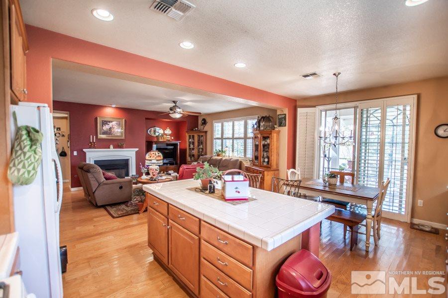 10655 Cedar Bend Court Reno, NV 89521 - Photo 5 of 16 a view of a kitchen with dining table and chairs