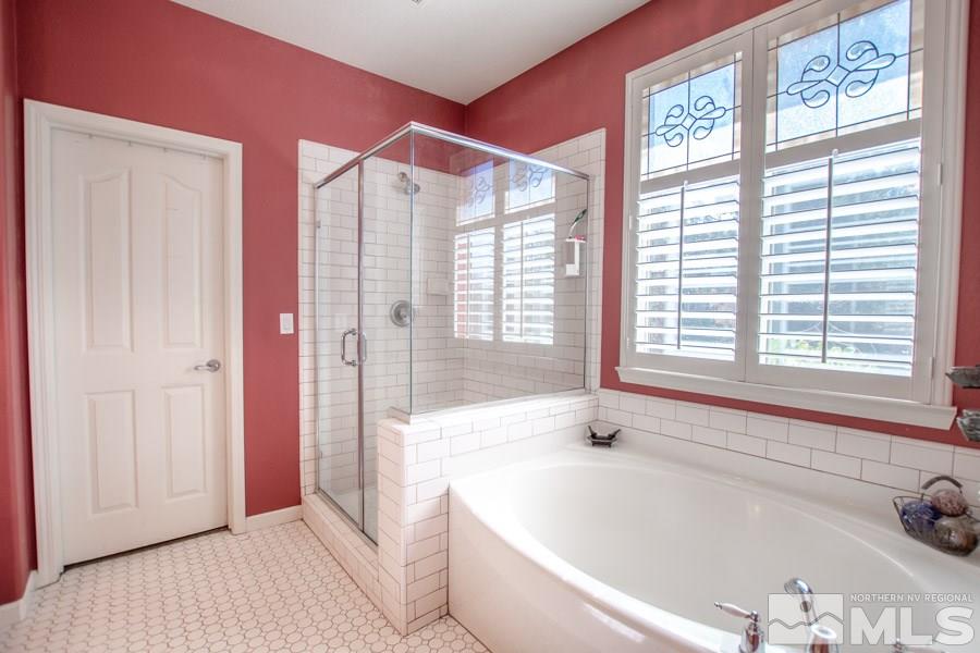 10655 Cedar Bend Court Reno, NV 89521 - Photo 8 of 16 a bathroom with a bathtub and a shower