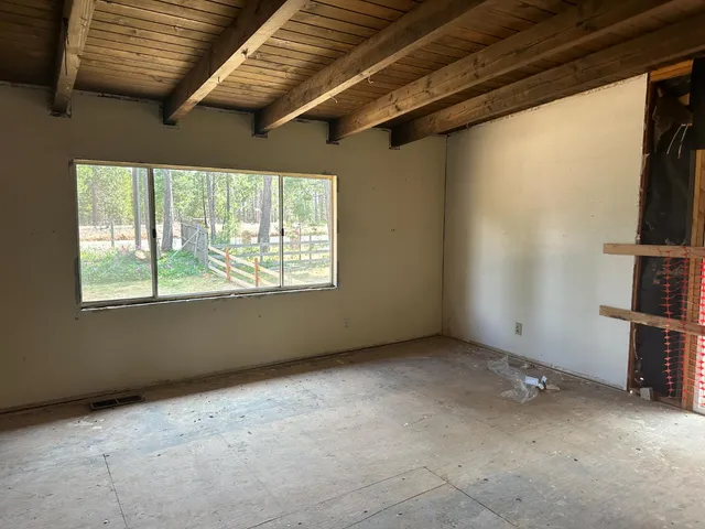 a view of a porch with wooden floor