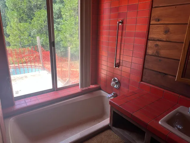 a view of swimming pool with a lake view