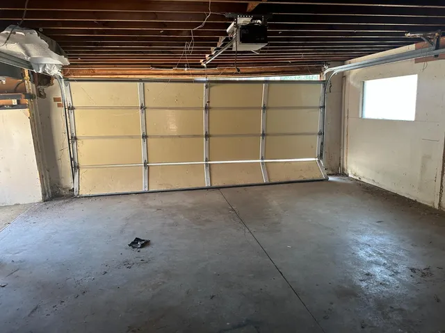 a view of an empty room with a fireplace