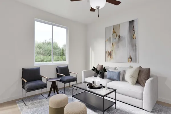 a living room with furniture and a large window