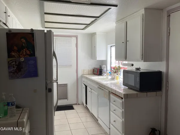 a bedroom with furniture and a dresser