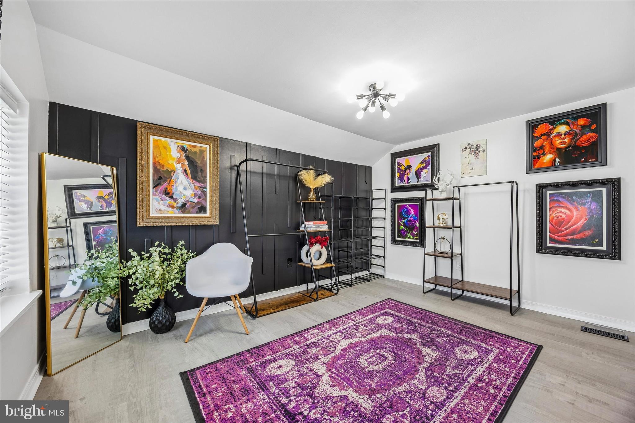 145 Conarroe Street Philadelphia, PA 19127 - Photo 20 of 28 a living room with furniture and a rug