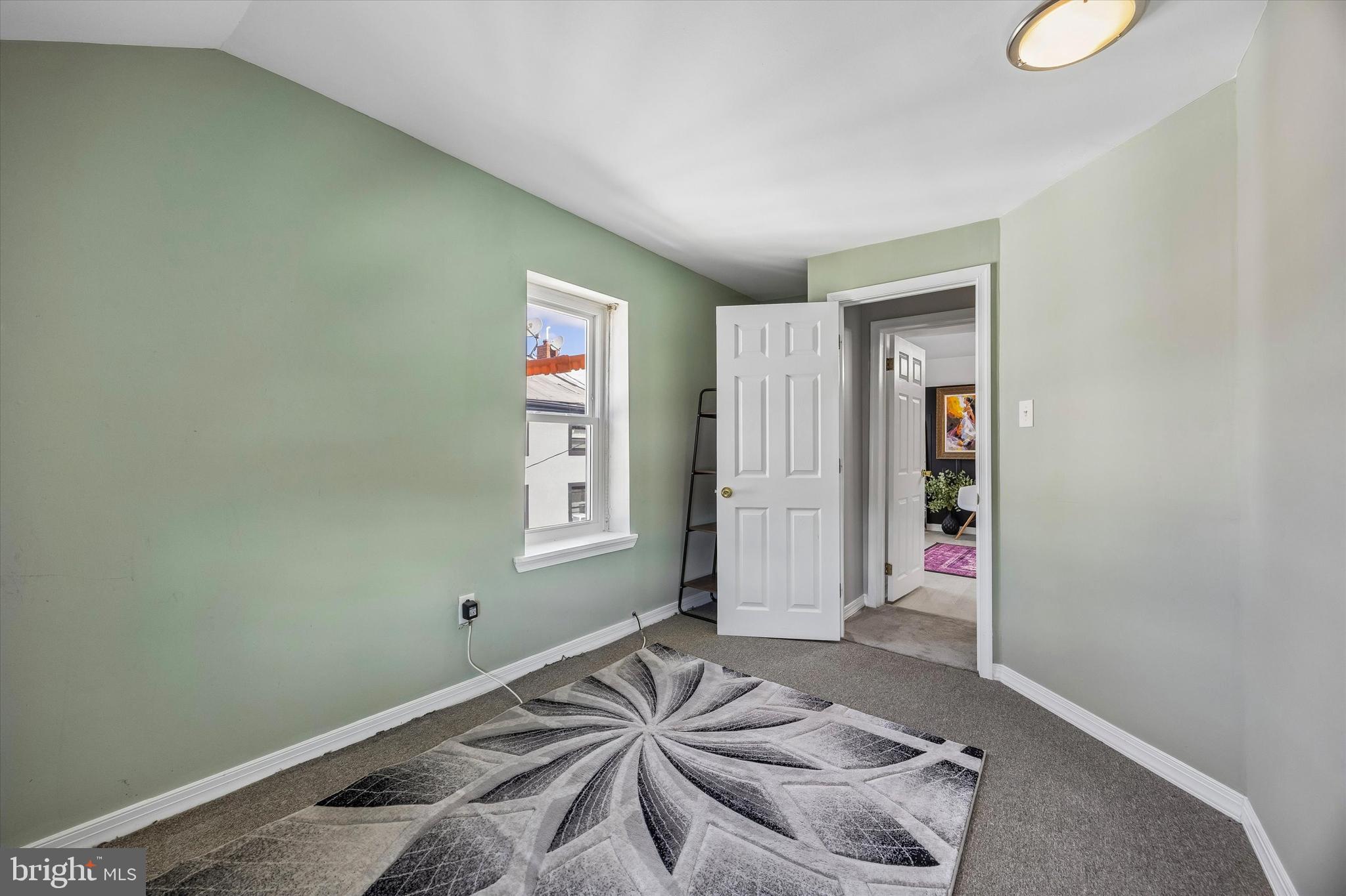 145 Conarroe Street Philadelphia, PA 19127 - Photo 24 of 28 a bedroom with a bed and a window