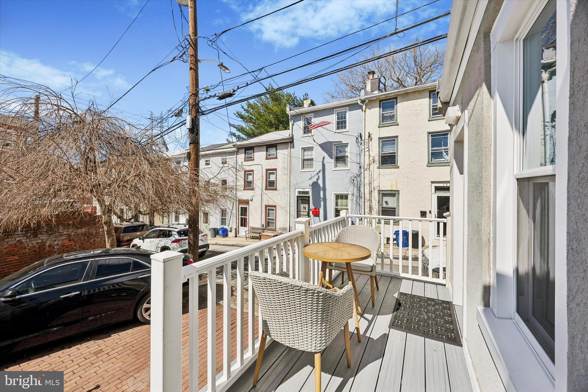 145 Conarroe Street Philadelphia, PA 19127 - Photo 25 of 28 a view of a balcony with chairs and wooden floor