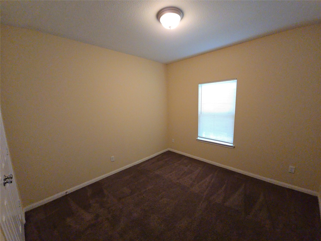 8205 Claiborne Street Houston, TX 77078 - Photo 12 of 26 an empty room with a empty space and a window