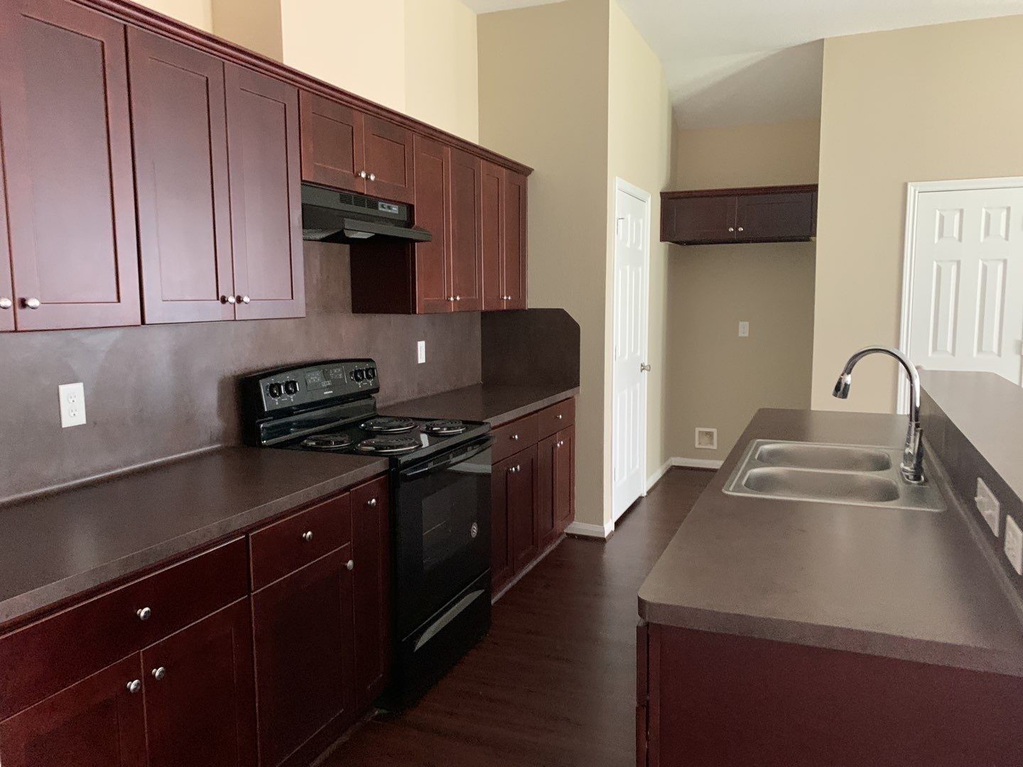 8205 Claiborne Street Houston, TX 77078 - Photo 15 of 26 a kitchen with a sink and a stove top oven