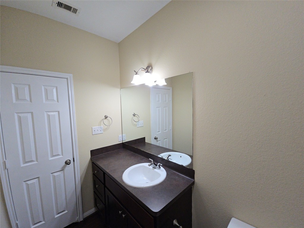 8205 Claiborne Street Houston, TX 77078 - Photo 16 of 26 a bathroom with a sink and a mirror