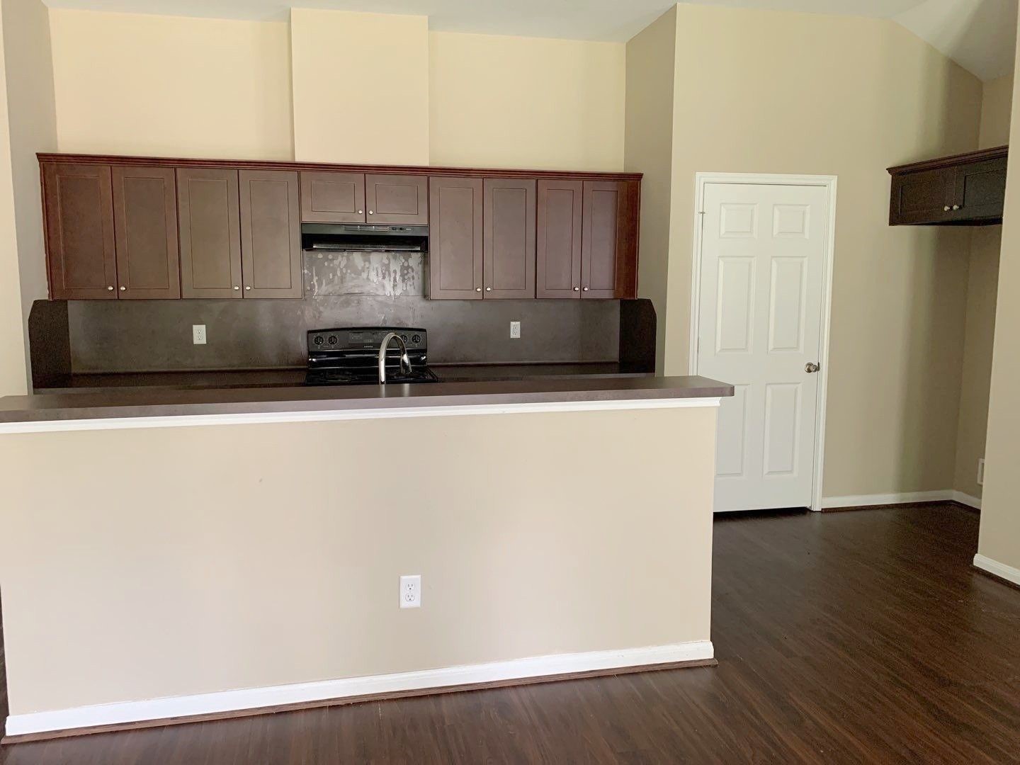 8205 Claiborne Street Houston, TX 77078 - Photo 5 of 26 a kitchen with wooden cabinets and refrigerator