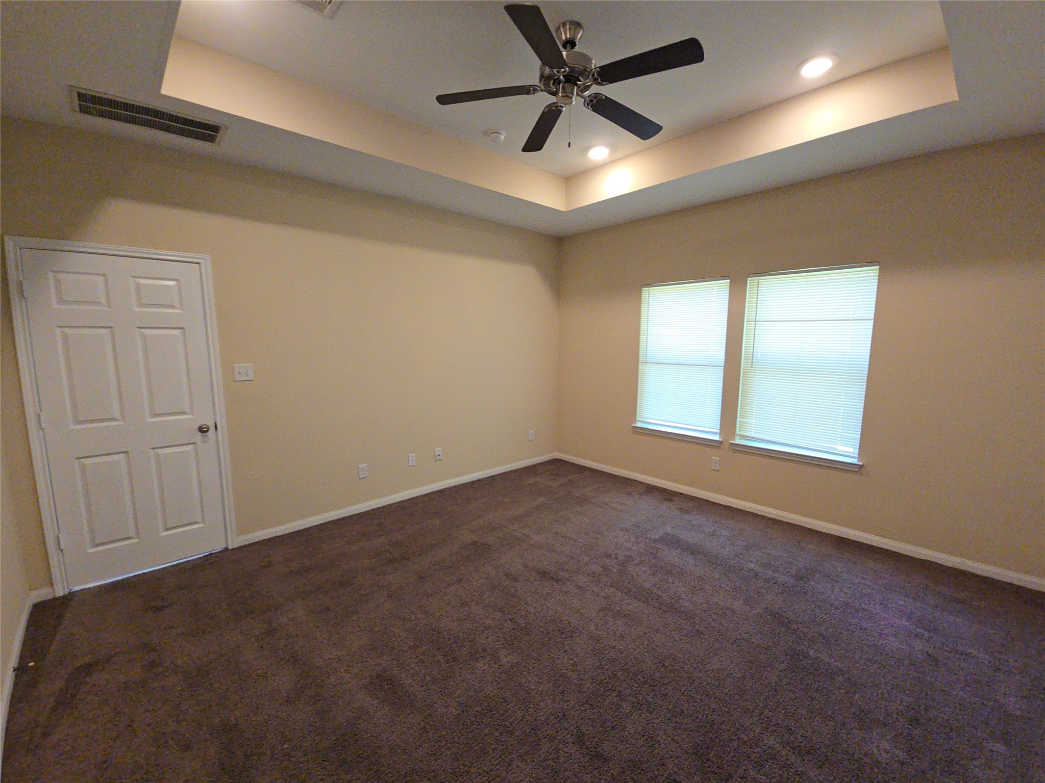 8205 Claiborne Street Houston, TX 77078 - Photo 8 of 26 an empty room with a window and a fan