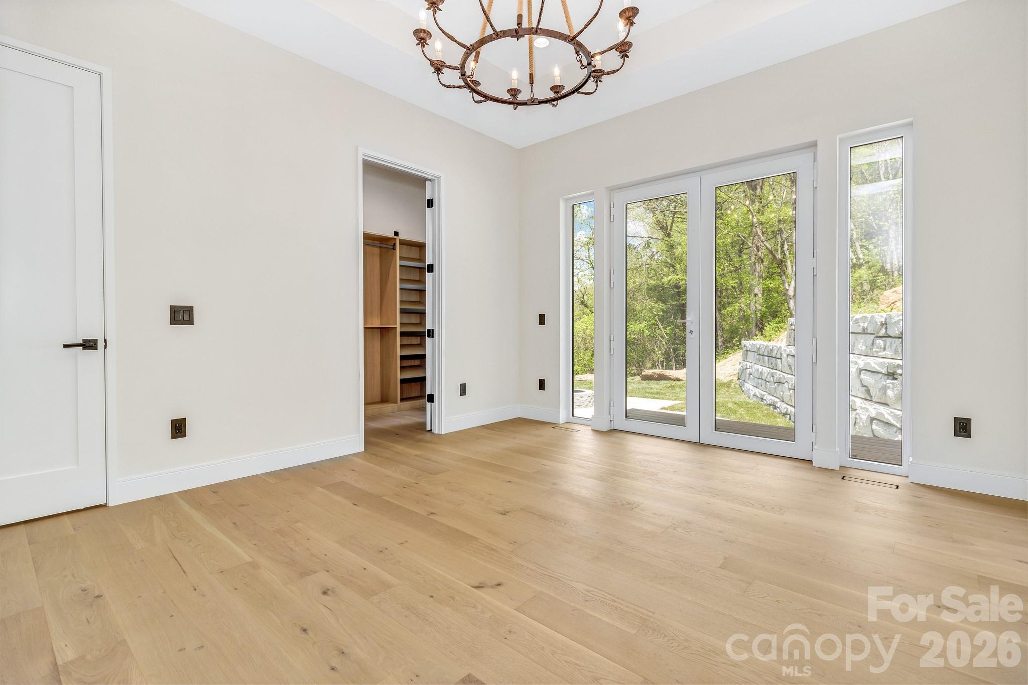 134 View Ridge Parkway Leicester, NC 28748 - Photo 22 of 48 a view of an empty room with window a ceiling fan