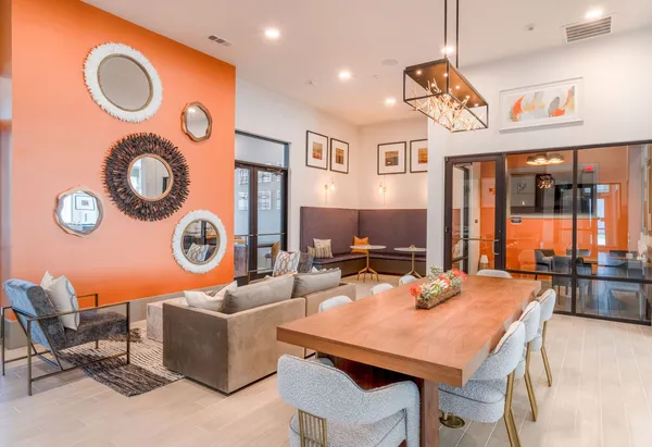 a view of a dining room with furniture and chandelier