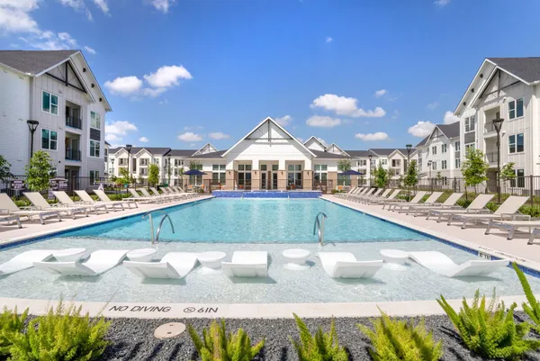 a view of a swimming pool with a lounge chairs
