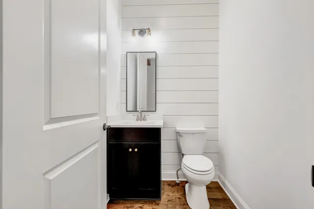 a view of a kitchen with wooden floor