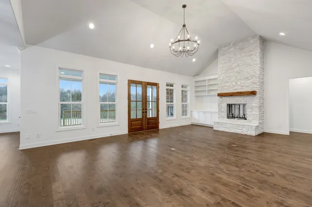 a kitchen with stove and cabinets