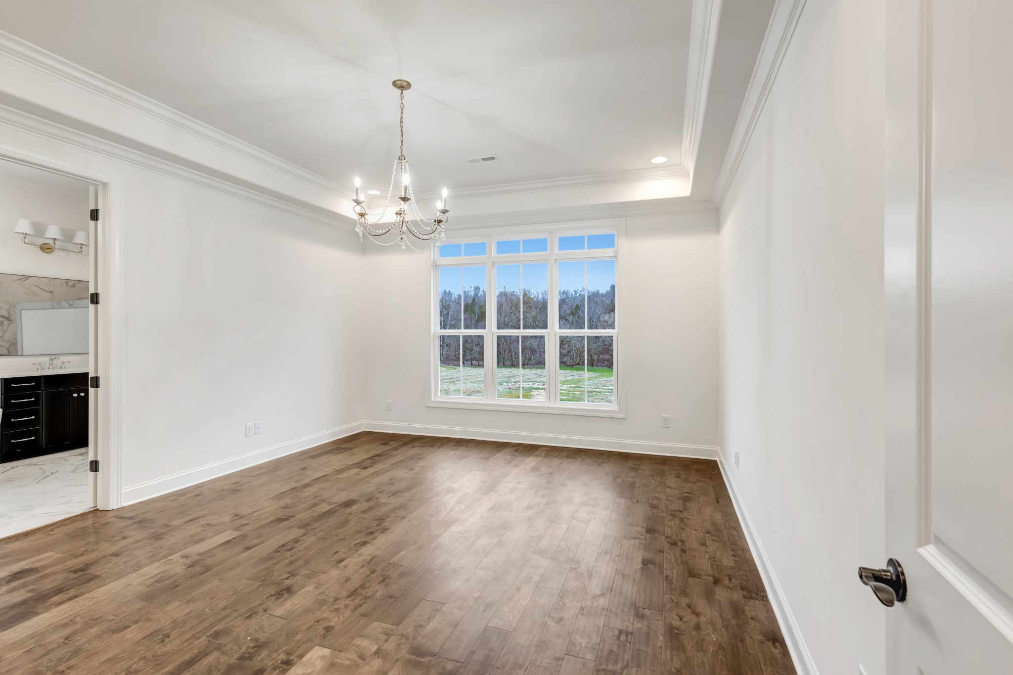 7483 Liberty Road Fairview, TN 37062 - Photo 16 of 65 wooden floor in an empty room with a window