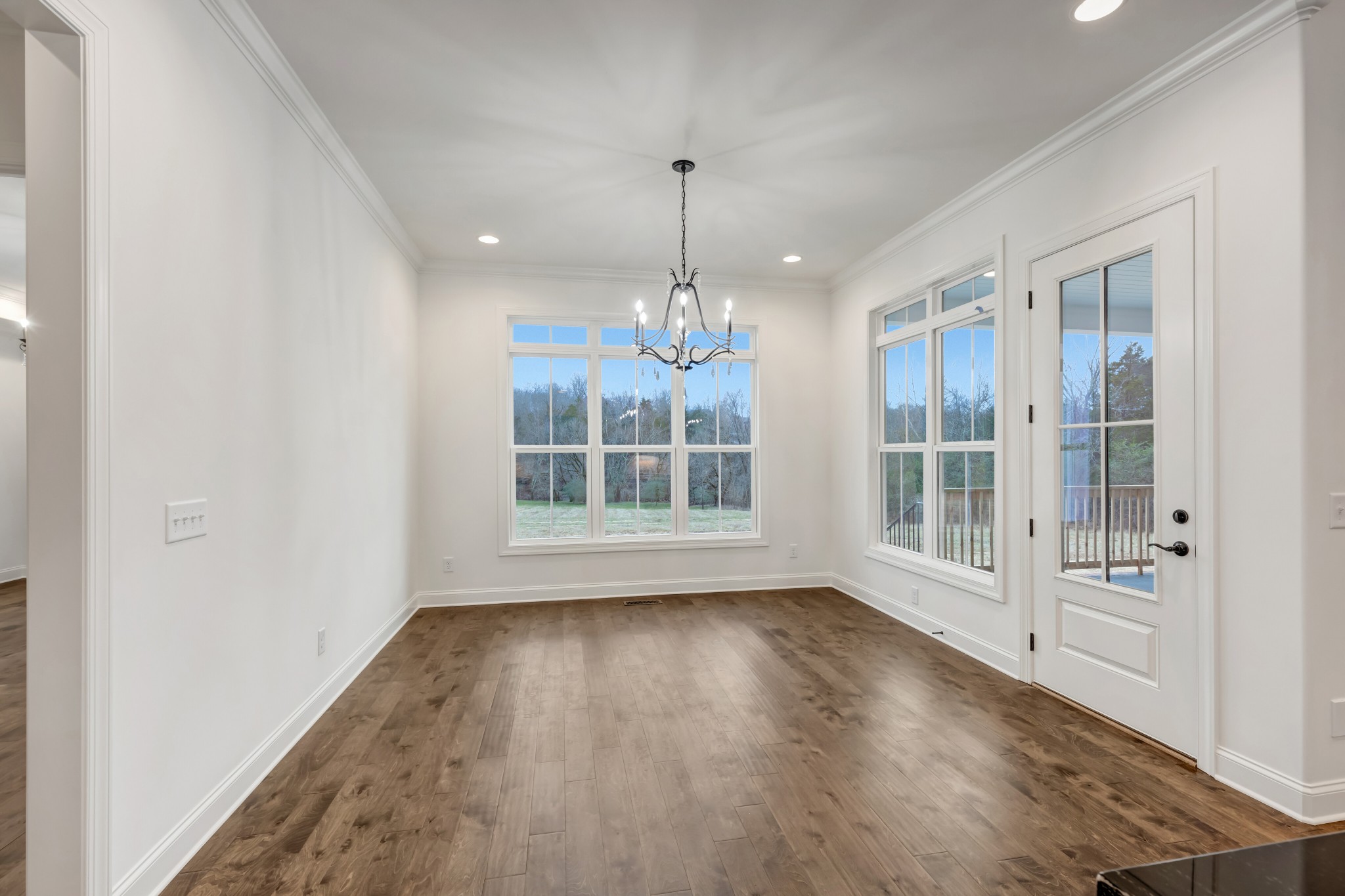 7483 Liberty Road Fairview, TN 37062 - Photo 22 of 65 a view of an empty room with wooden floor and a window